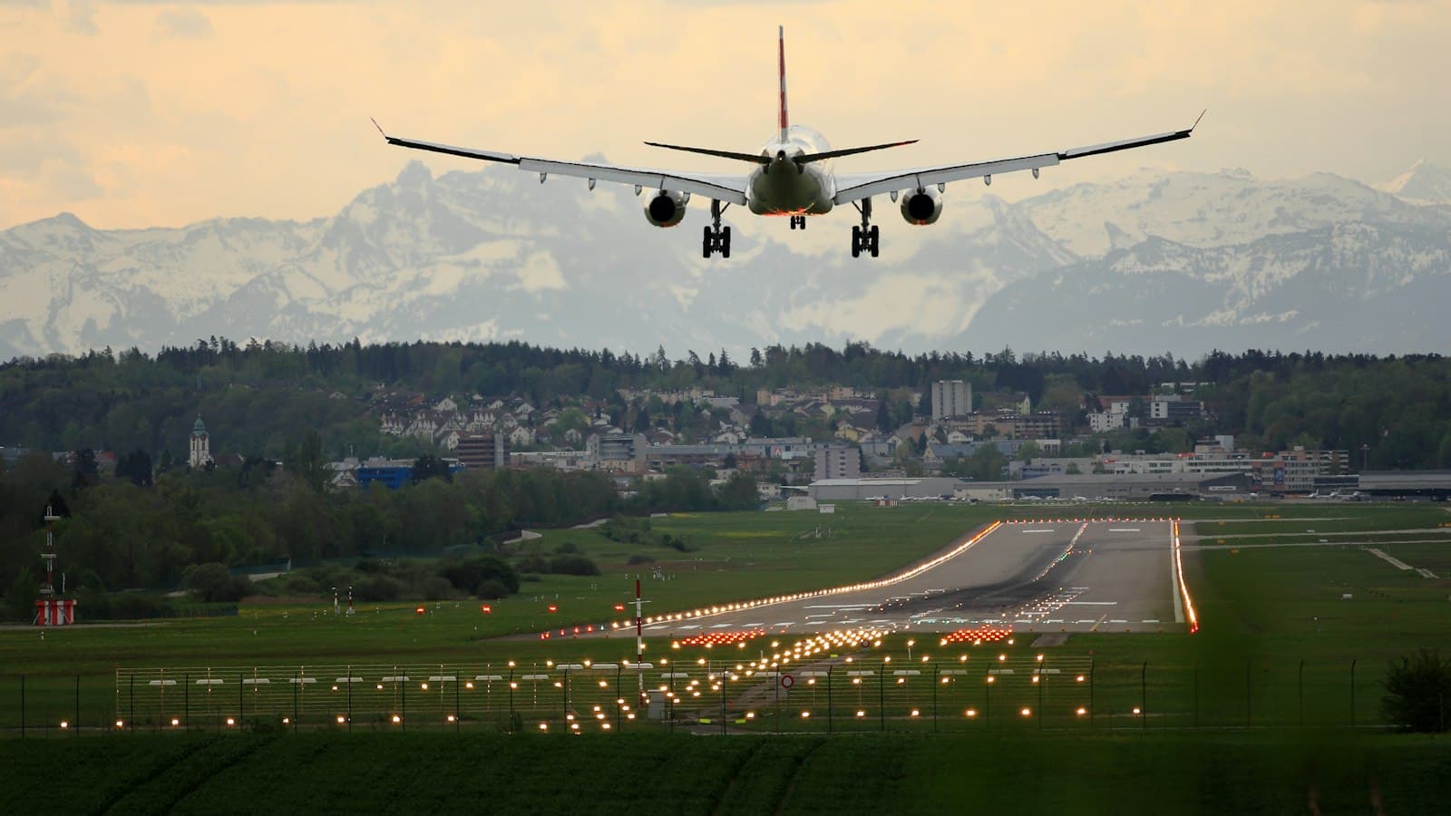 Passenger jet landing over mountains